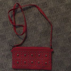 Red clutch with skulls.